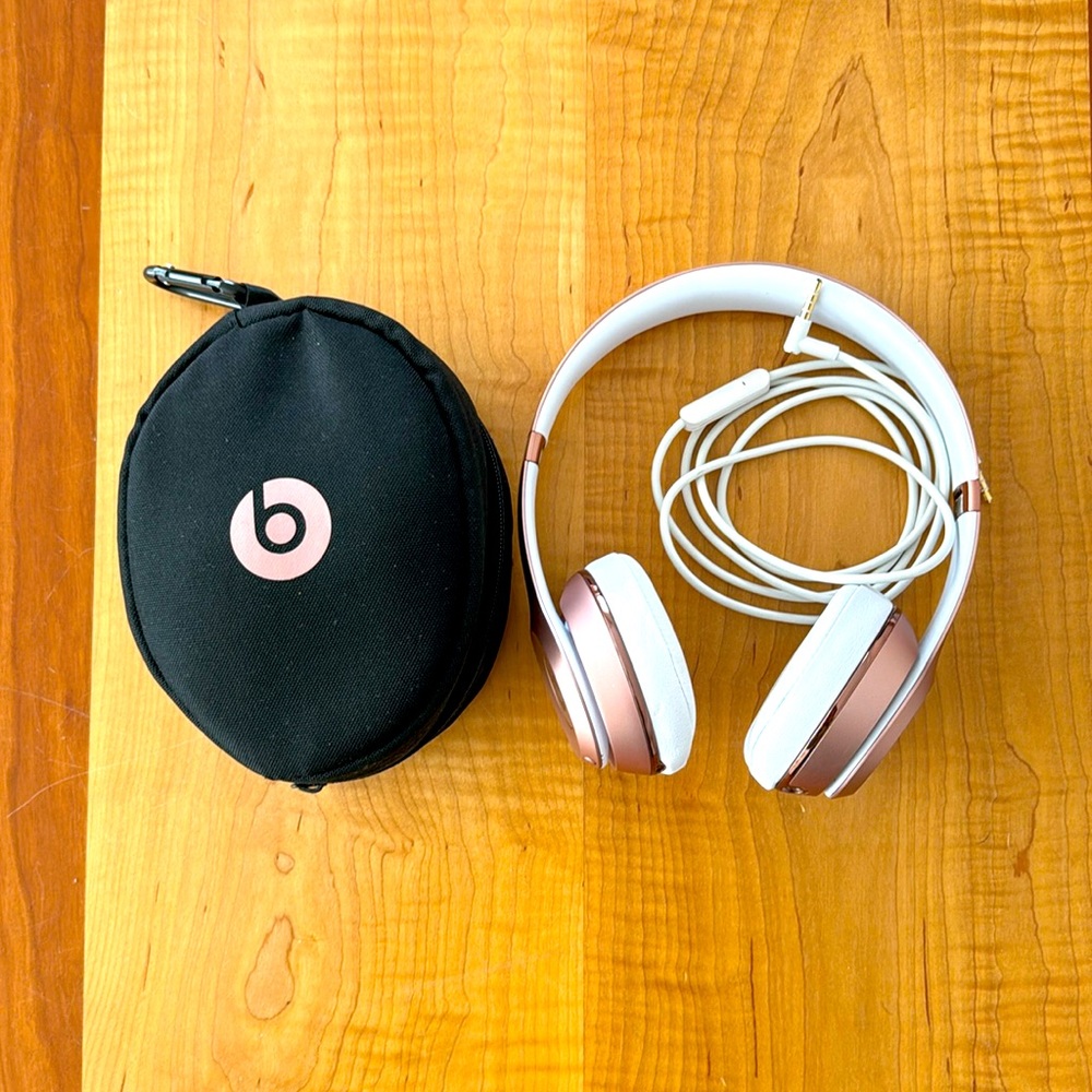 Rose gold beats head phones